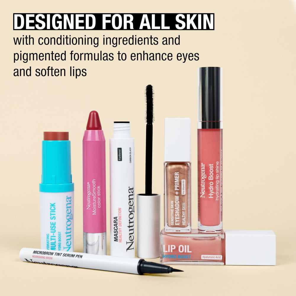 Neutrogena tube beside common items to show travel-friendly scale