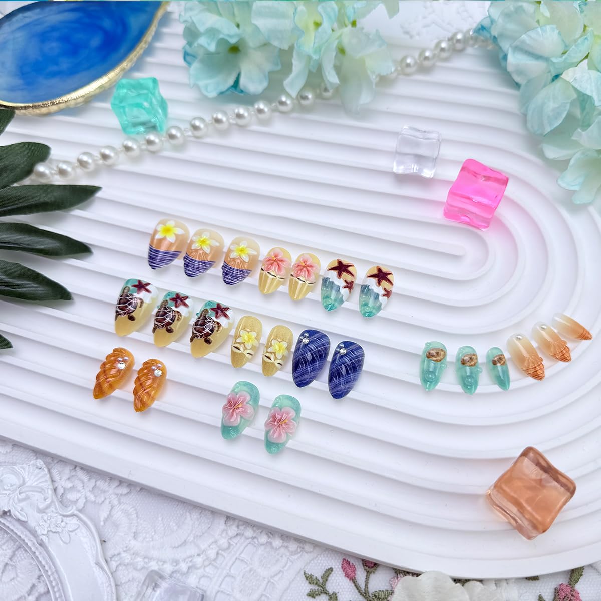NEWSPIED close-up of 3D seashell and turtle details, textured ocean accent look