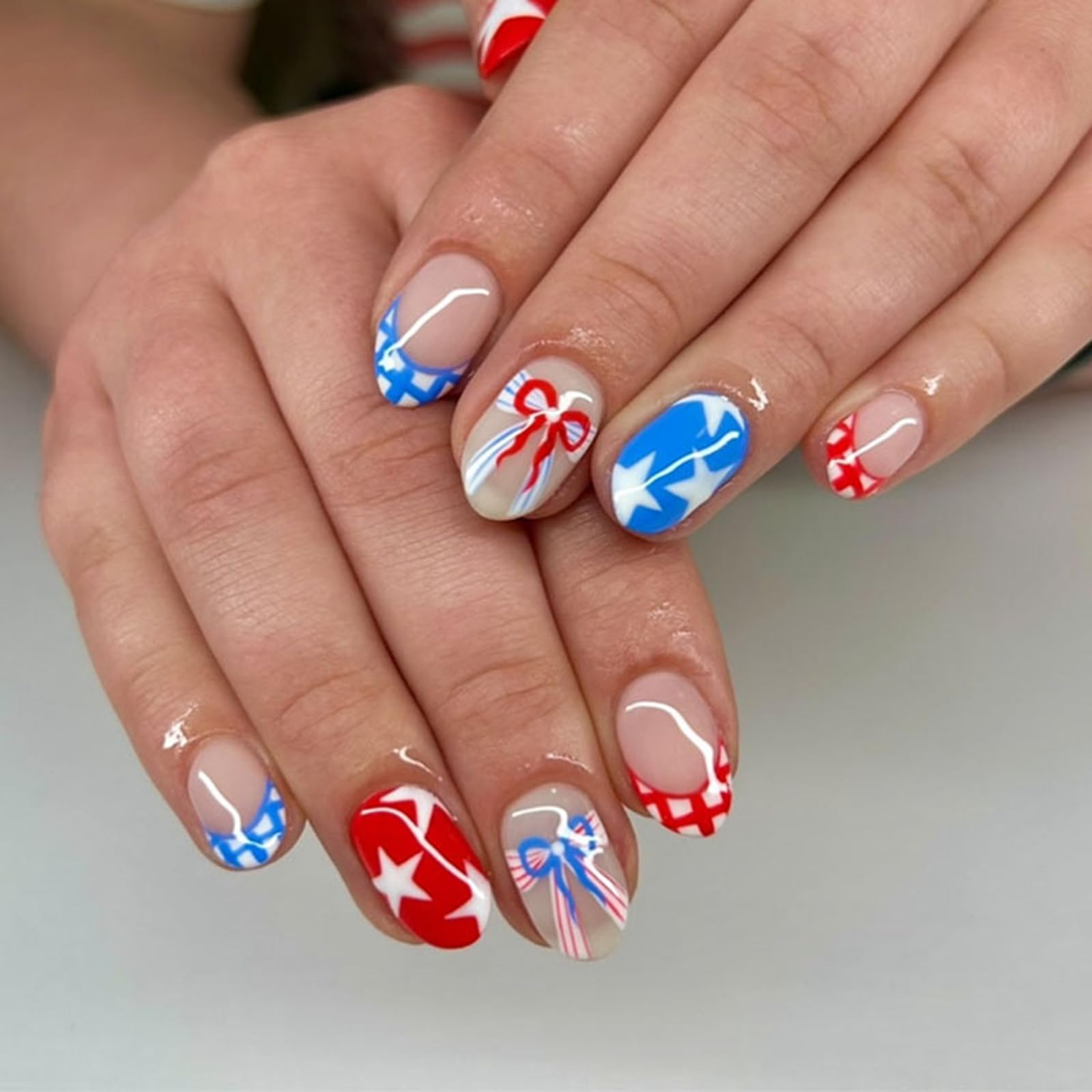 NEWSPIED front packaging showing 24-piece patriotic press-on nails for quick styling