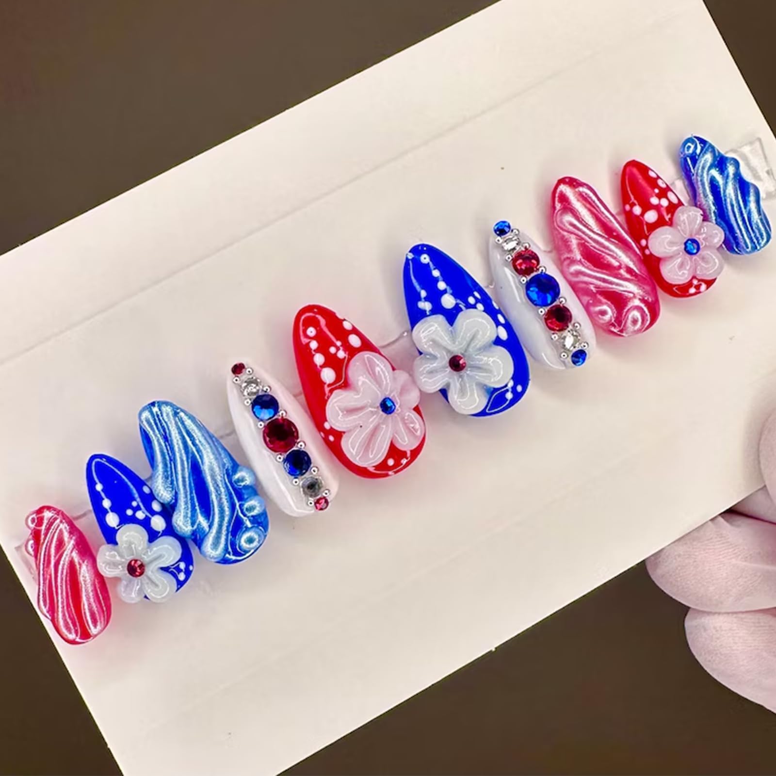 NEWSPIED front packaging showing full 24-piece patriotic nail set and accessories for quick application