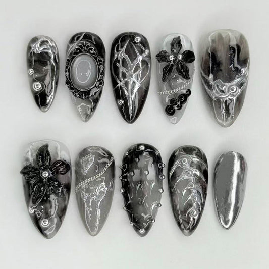 NEWSPIED front packaging showing 24-piece gothic press-on nails, ready-to-wear benefit