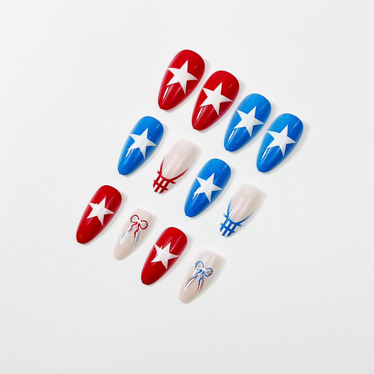 NEWSPIED worn on hands showing finished patriotic manicure for event-ready look