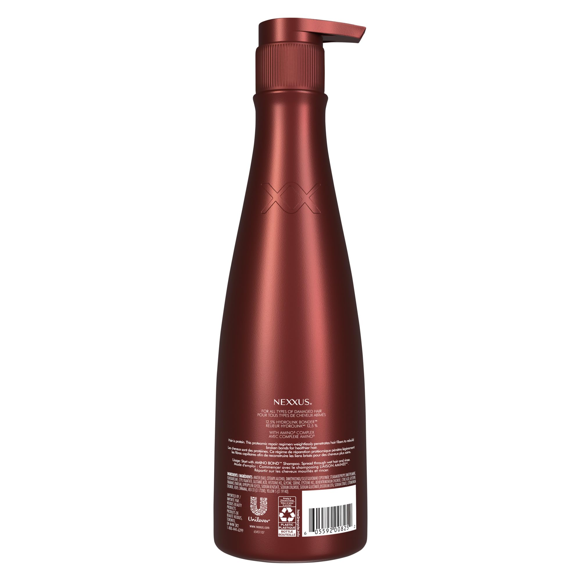 Nexxus 13.5 oz bottle beside hand to display scale and travel-friendly size