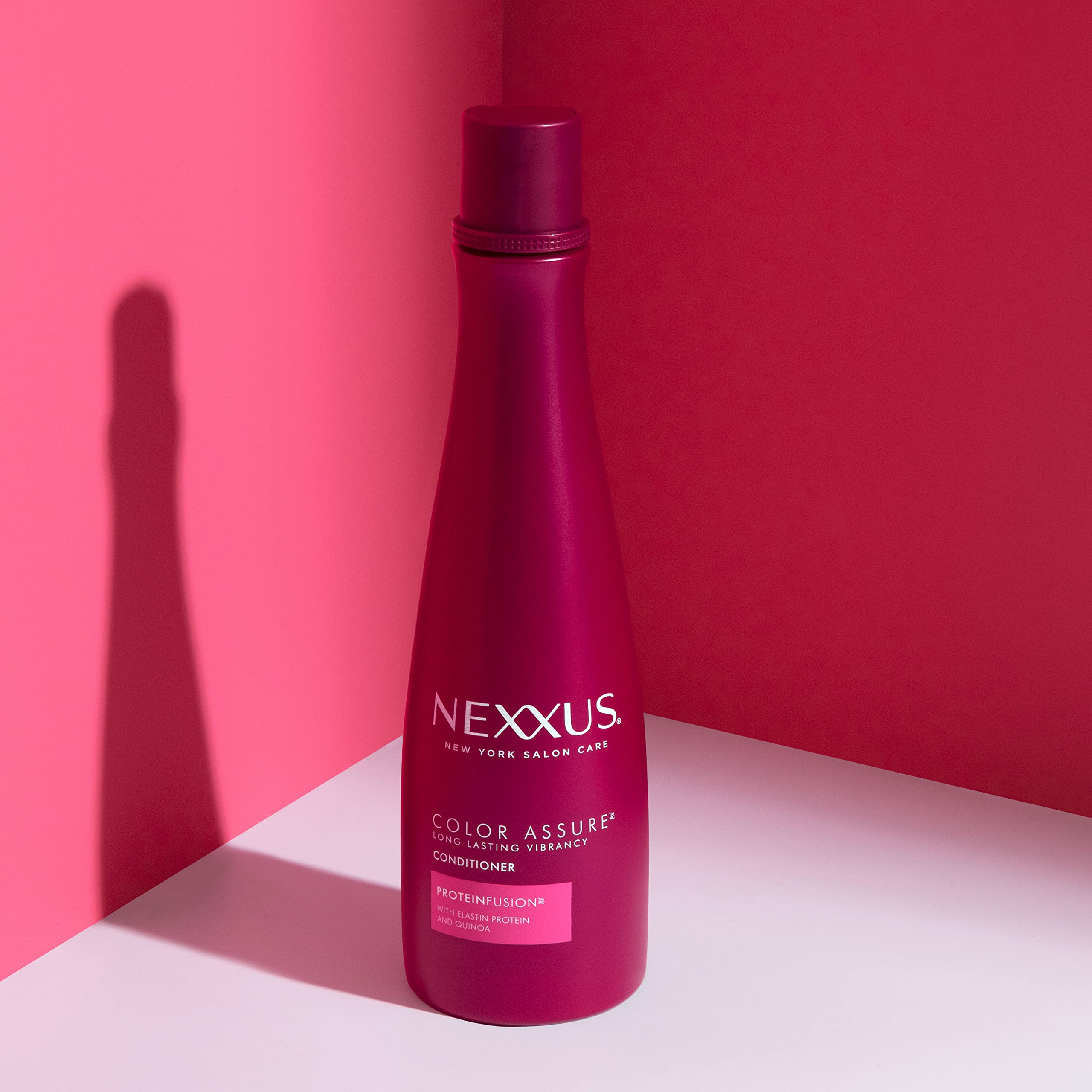 Nexxus conditioner applied to wet hair demonstrating smooth detangling
