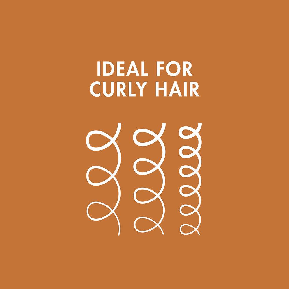 Nexxus being applied to curly hair demonstrating easier styling