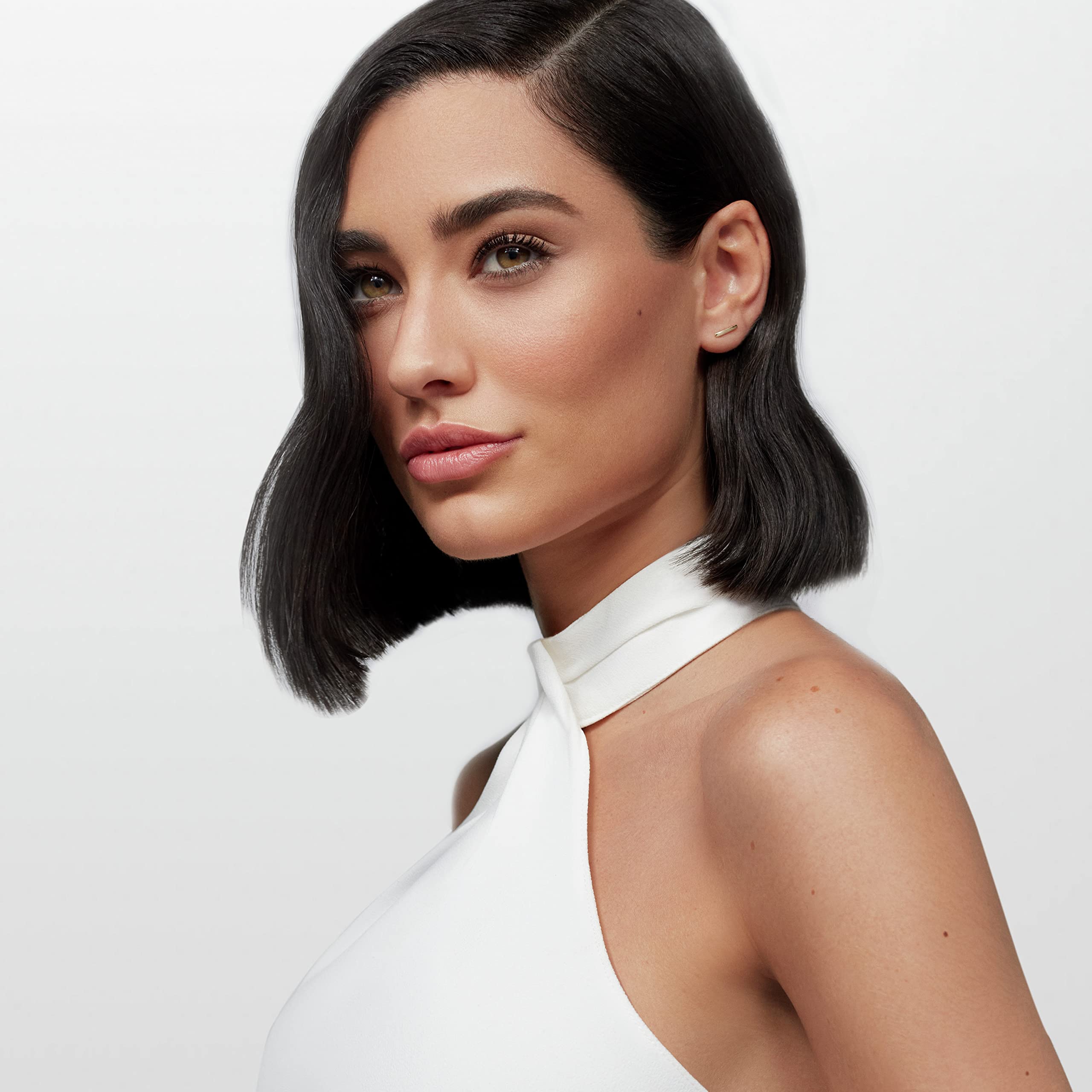 Nexxus on styled short hair highlighting defined, touchable finish benefit