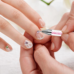 NFRBTD tool in use on nail art showing controlled placement for neat embellishments