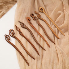 Ngdhkd hair sticks securing a bun in use, demonstrating strong hold and elegance