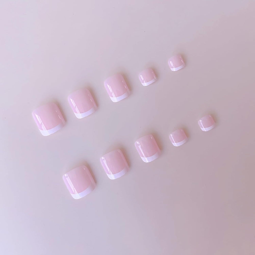 NHIXK applying a press-on nail on a finger, demonstrating simple 15-second at-home application
