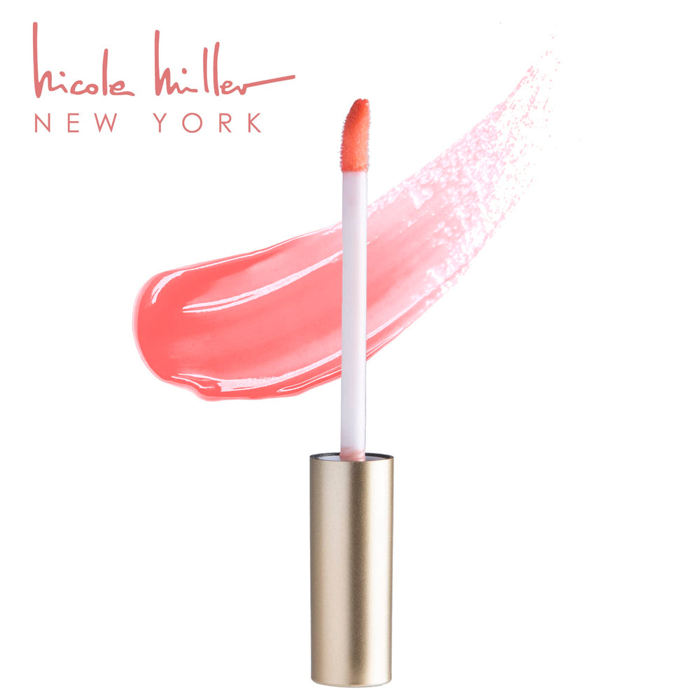 Nicole Miller gloss held in hand to show size and portability for on-the-go touch ups