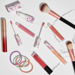Nicole Miller application on lips in lifestyle scene showing radiant shine and stylish look
