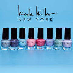 Nicole Miller bottles beside a coin for size comparison and compactness benefit
