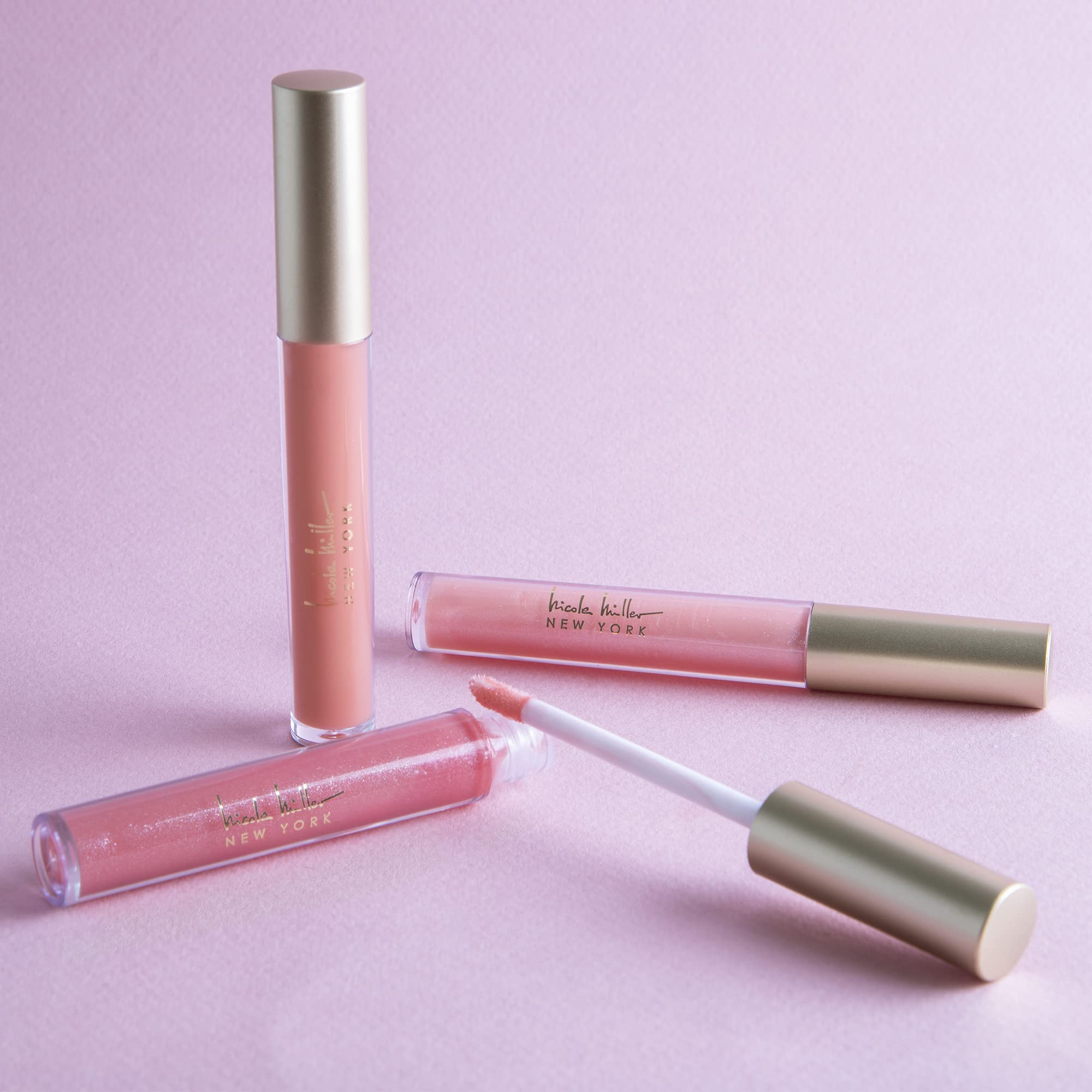 Nicole Miller open applicator close-up highlighting smooth glossy finish and easy application