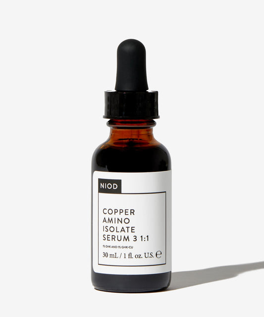 NIOD serum dropper releasing liquid, demonstrating lightweight texture and quick absorption