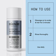 NIOXIN 50mL bottle held in hand showing travel-friendly size