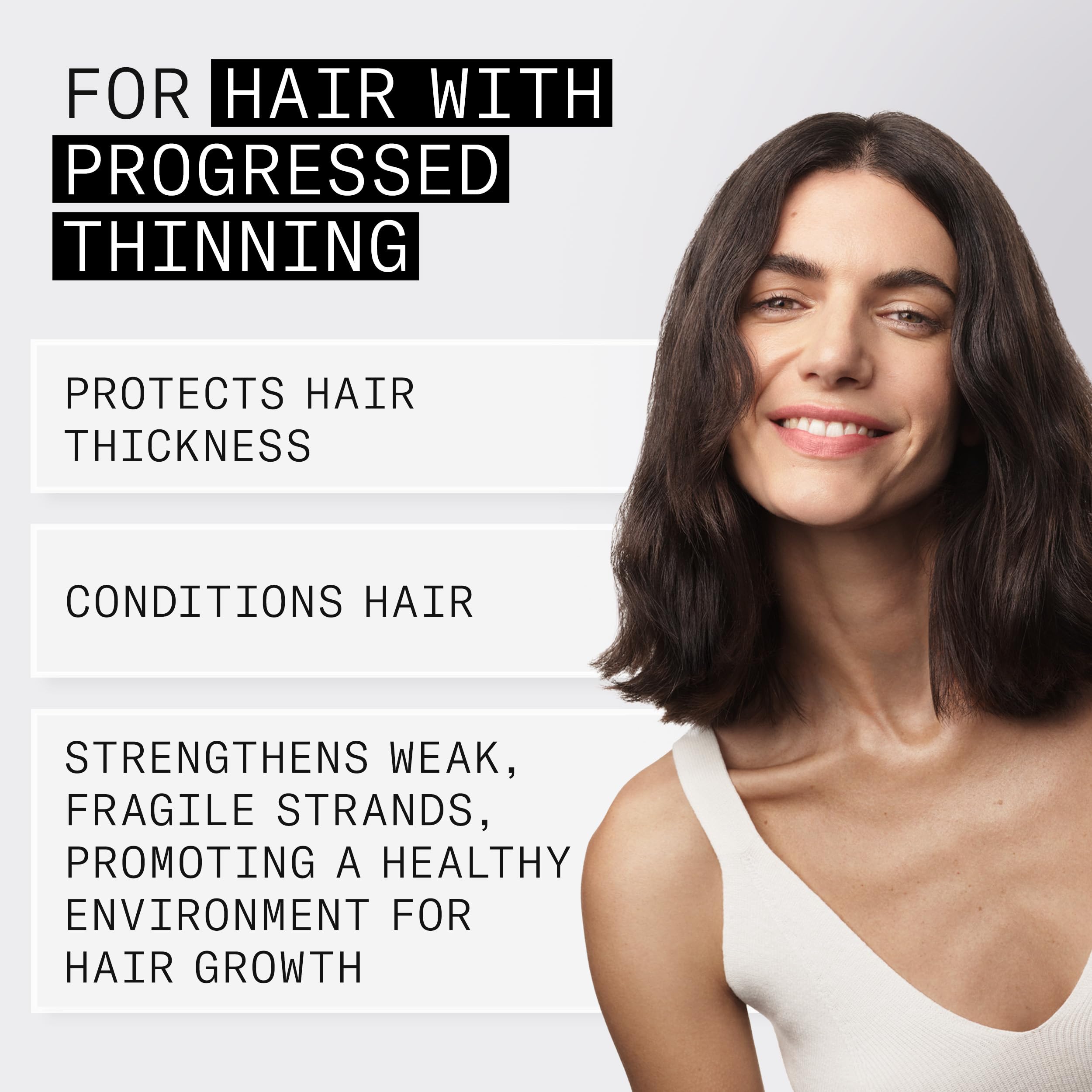 Nioxin applied to scalp at hairline demonstrating targeted spot treatment