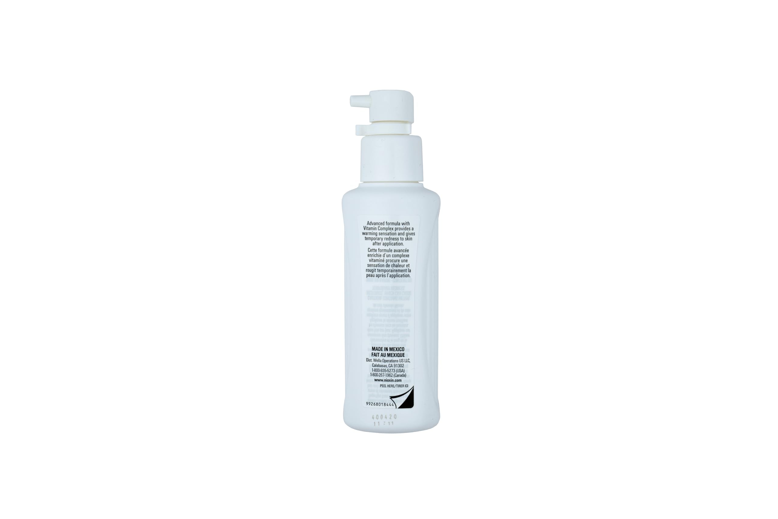 Nioxin bottle staged in bathroom routine showing daily-use convenience benefit