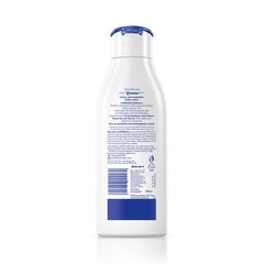 NIVEA bottle held in hand showing 200ml size and travel-friendly benefit