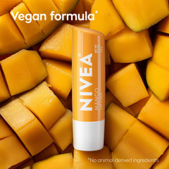 NIVEA lip balm beside fresh mango signaling natural scent and flavor benefit
