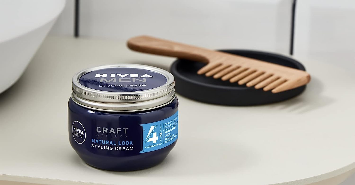 NIVEA MEN in-use styling scene with man applying cream for natural hold benefit