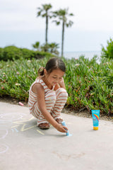NO-AD travel bottle tucked inside backpack for on-the-go protection benefit