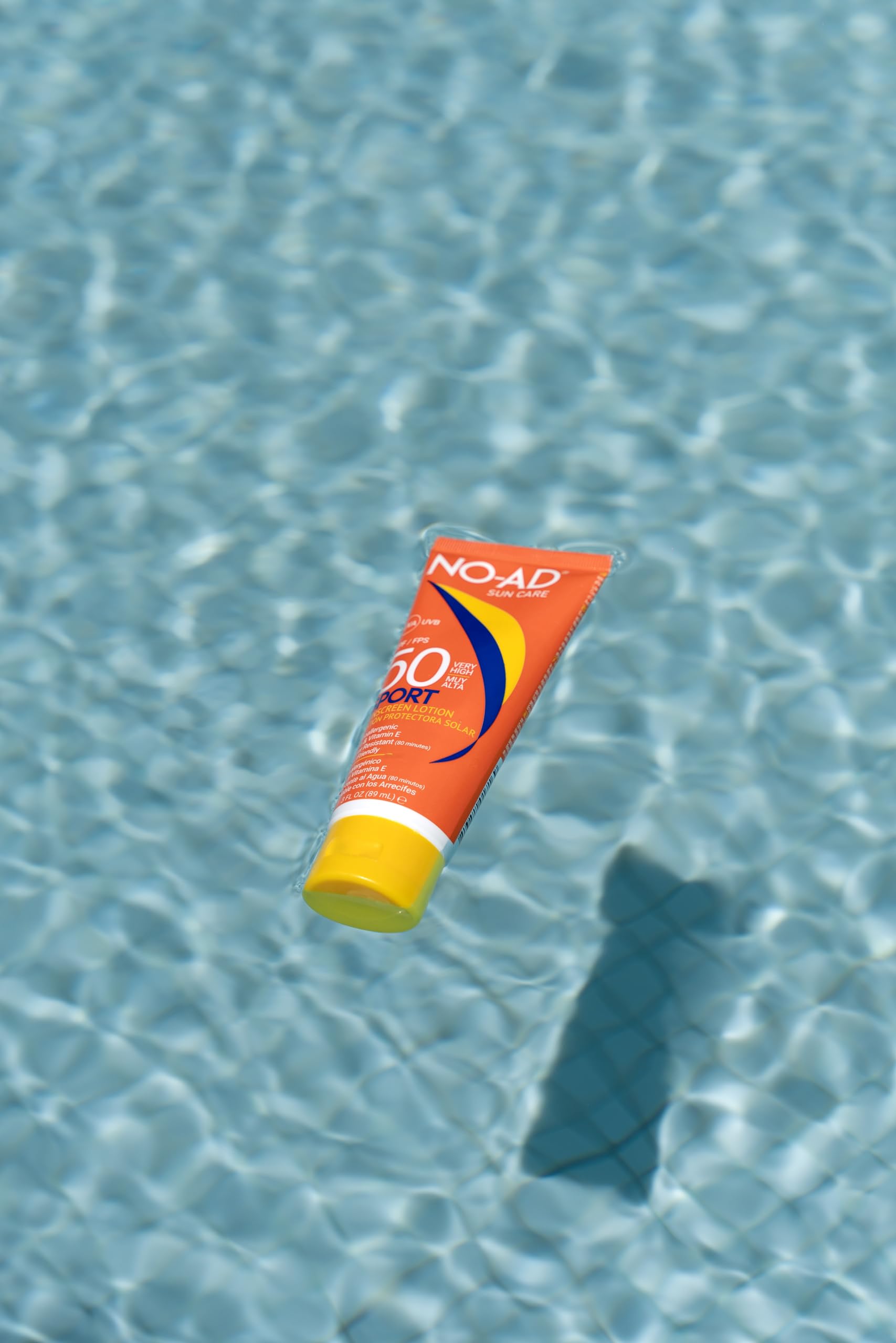 NO-AD sunscreen swatch on skin illustrating spreadability and low white cast
