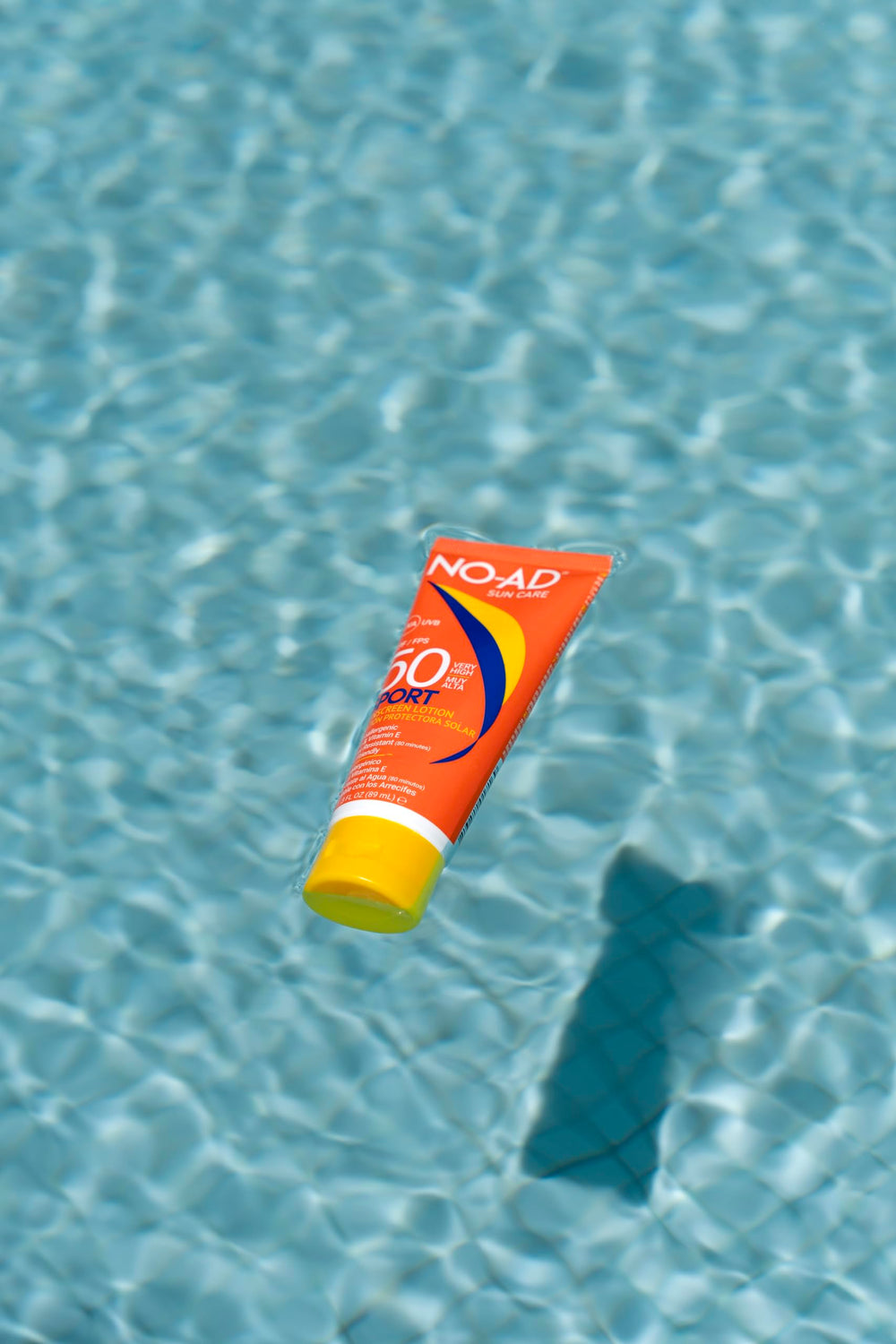 NO-AD sunscreen swatch on skin illustrating spreadability and low white cast