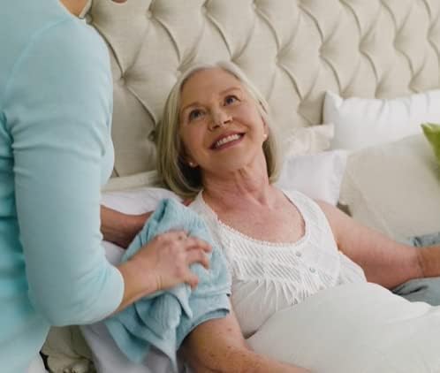 Caregiver using No-Rinse in bedside care demonstrating gentle cleaning