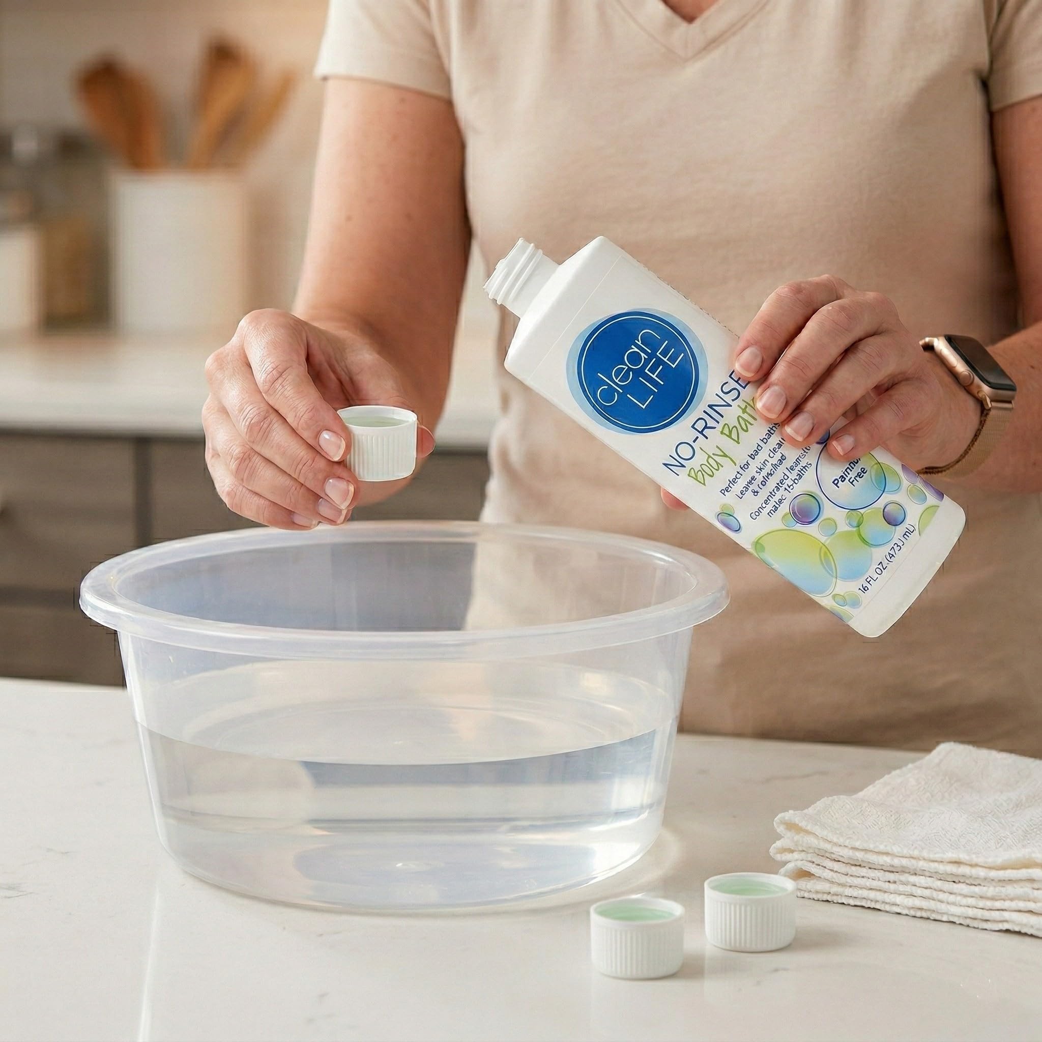 Diluted No-Rinse solution in a bowl ready for sponge bath, brand and clarity