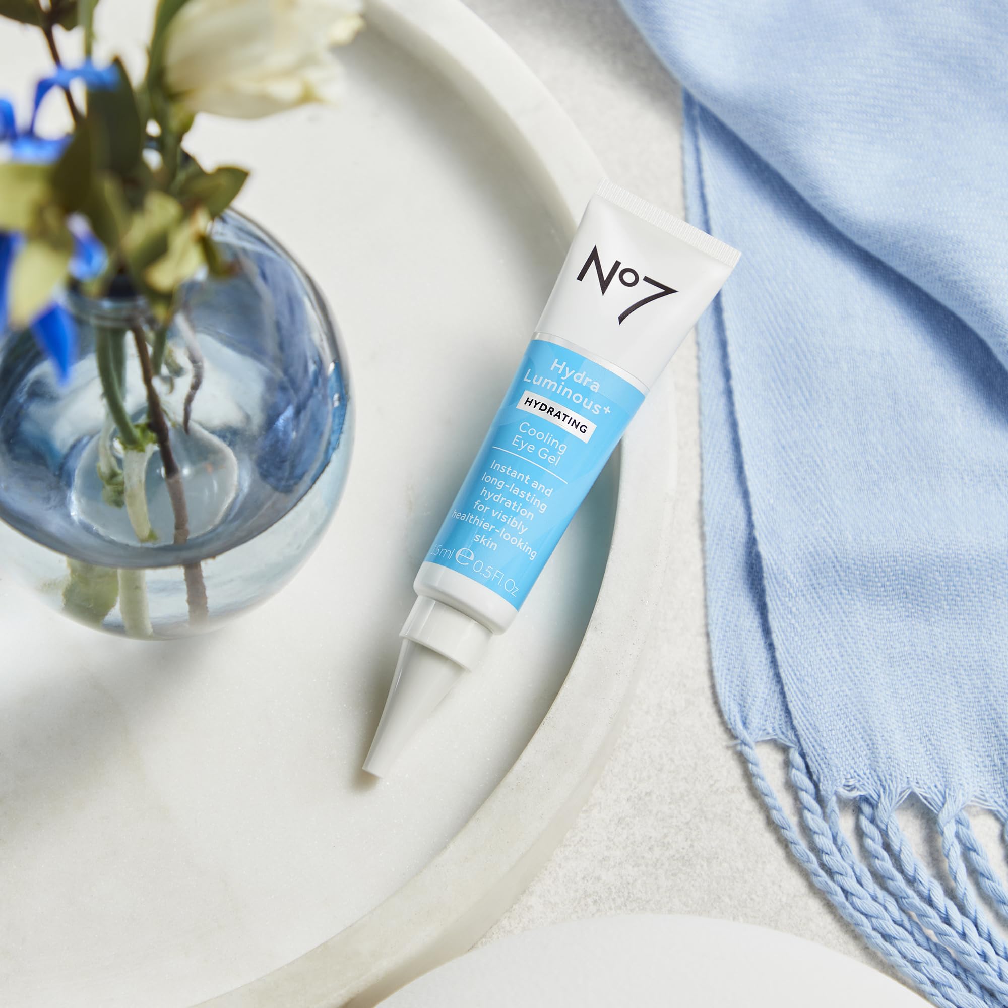 No7 applying under eye on model showcasing smoothing benefit