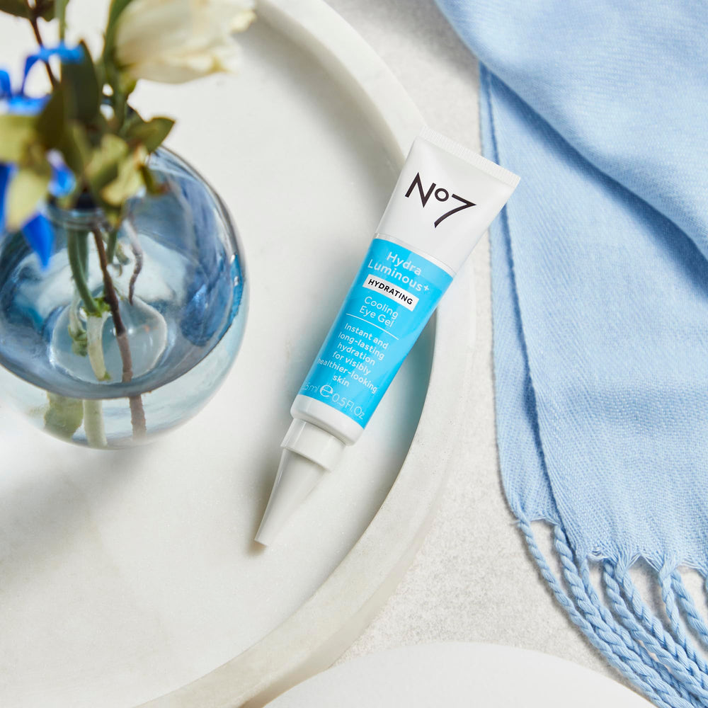 No7 applying under eye on model showcasing smoothing benefit