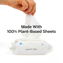 Nolla wipe beside a coin for scale demonstrating compact, portable size