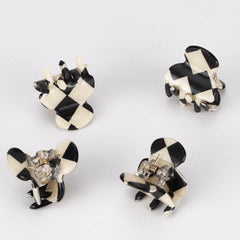 Ｎｏｏｎｈｏｒｓｅ checkered pattern close-up, highlights aesthetic detail