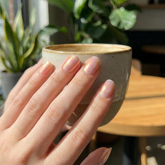 NovaCharm texture close-up highlighting fine pearlescent particles benefit: even luminous coverage
