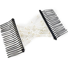 NSBELL combs held in hand for size comparison showing compact travel-friendly design
