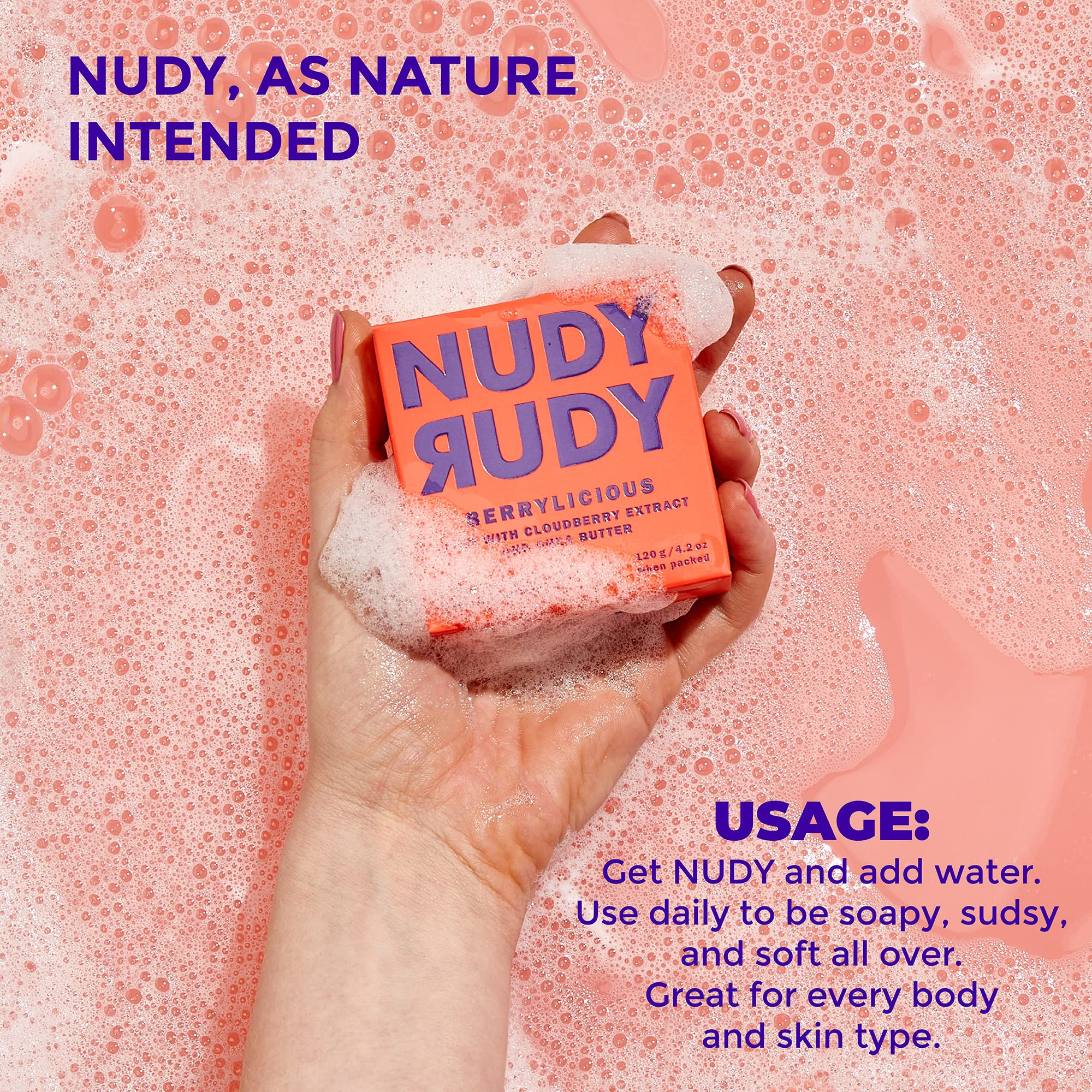 Nudy Rudy bar in hand for scale, conveys compact travel-friendly size