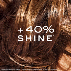 NUXE conditioner being applied to hair demonstrating easy spread and nourishment