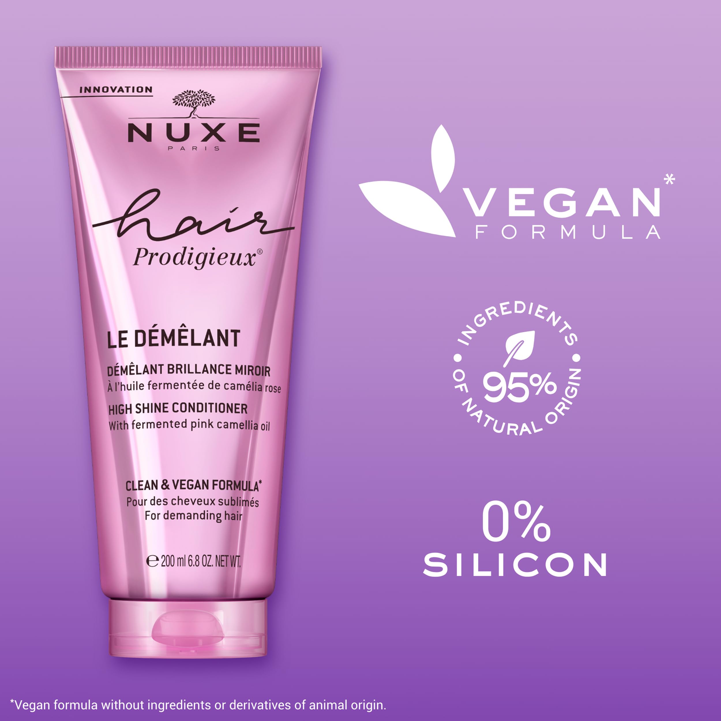NUXE tube beside a hand for scale to show the 6.8 fl oz size convenience