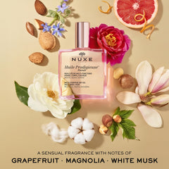 NUXE oil beside common items to show 3.3 fl oz size and portability benefit