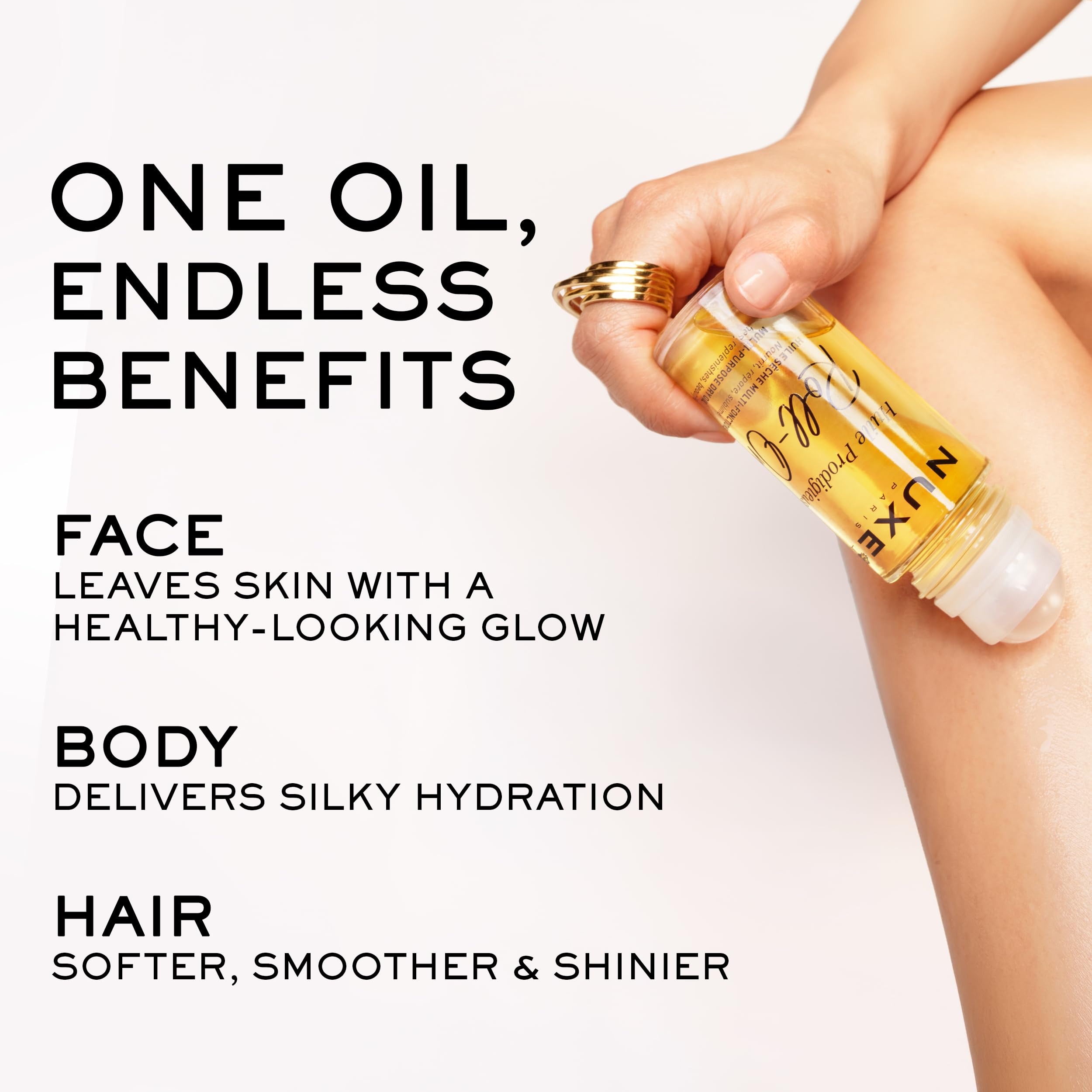 NUXE using roll-on on hair ends to nourish and tame frizz without weight