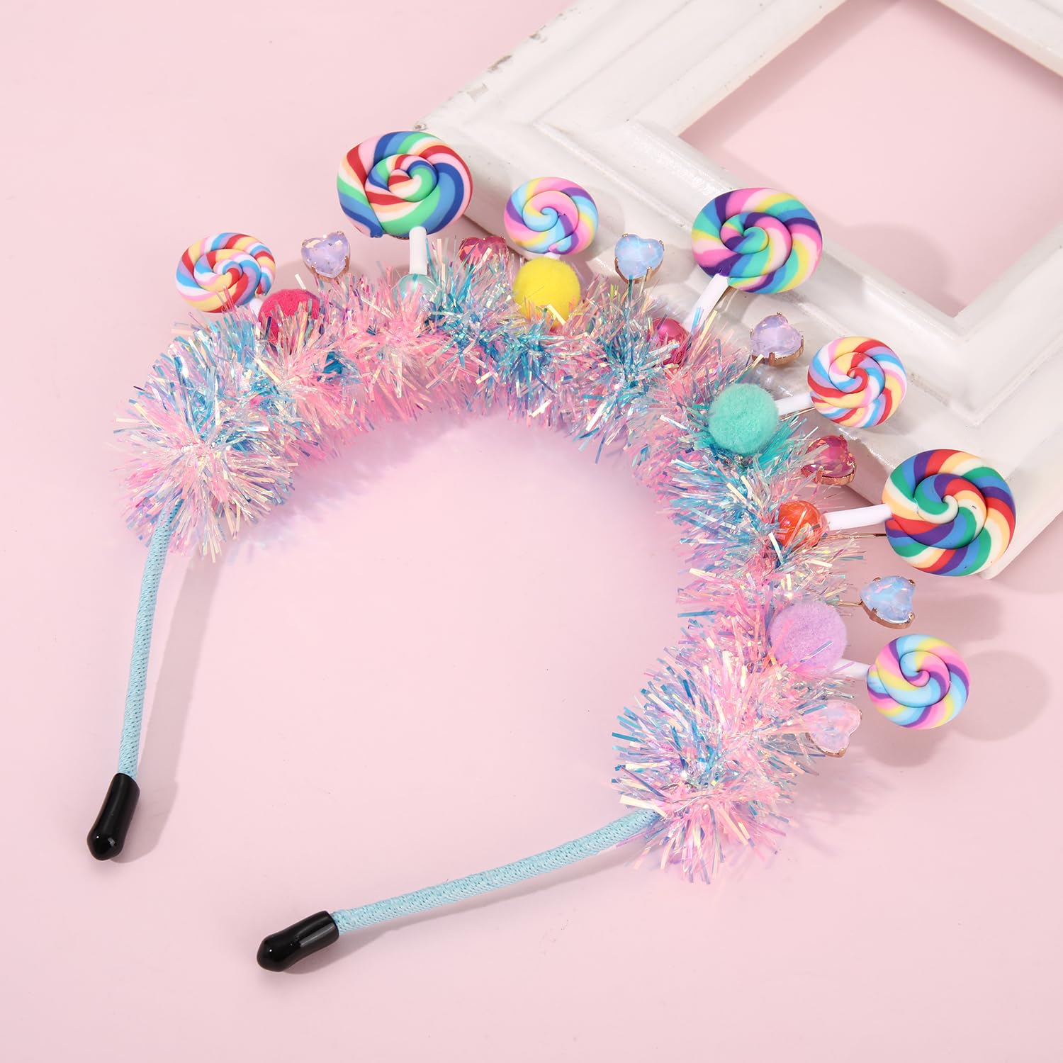 NVENF headband beside hand for scale, shows 5-inch lollipop size