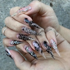 Nxtpz front packaging showing 24 glossy black stiletto nails and accessories for instant glam