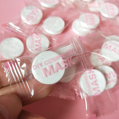 NYKKOLA coin-sized compressed mask compact for easy travel and storage
