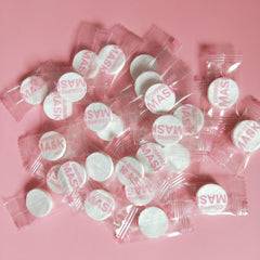 NYKKOLA individual pouches and full pack showing hygienic single-use benefits