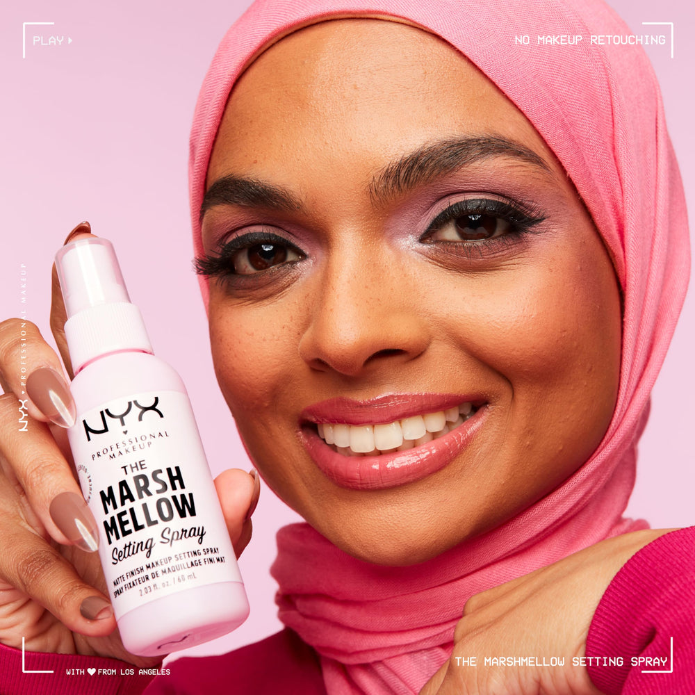 NYX PROFESSIONAL MAKEUP bottle held on forearm showing size and portability benefit