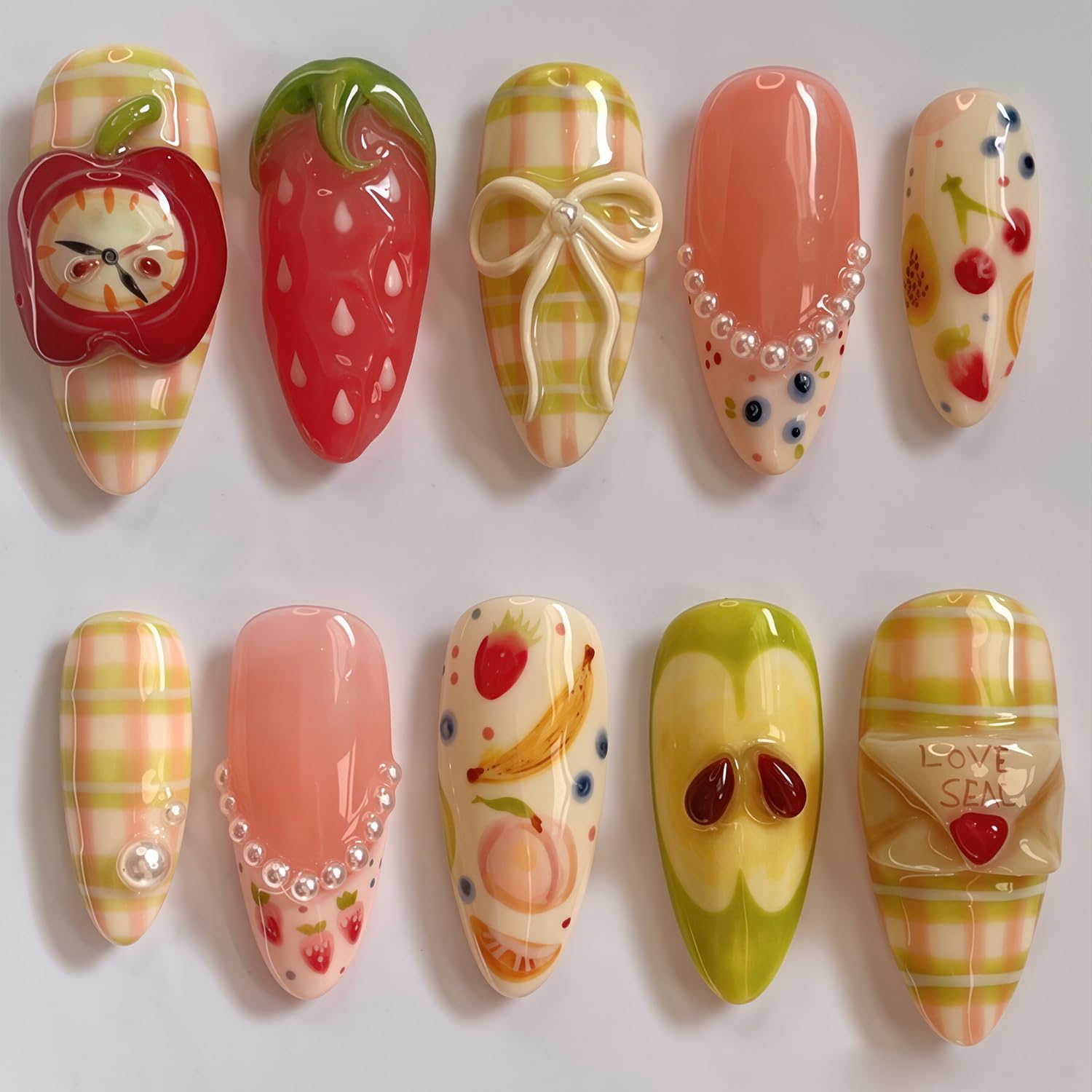 NZRAESTRS front packaging showing full 30-piece fruit press-on set, easy salon effect