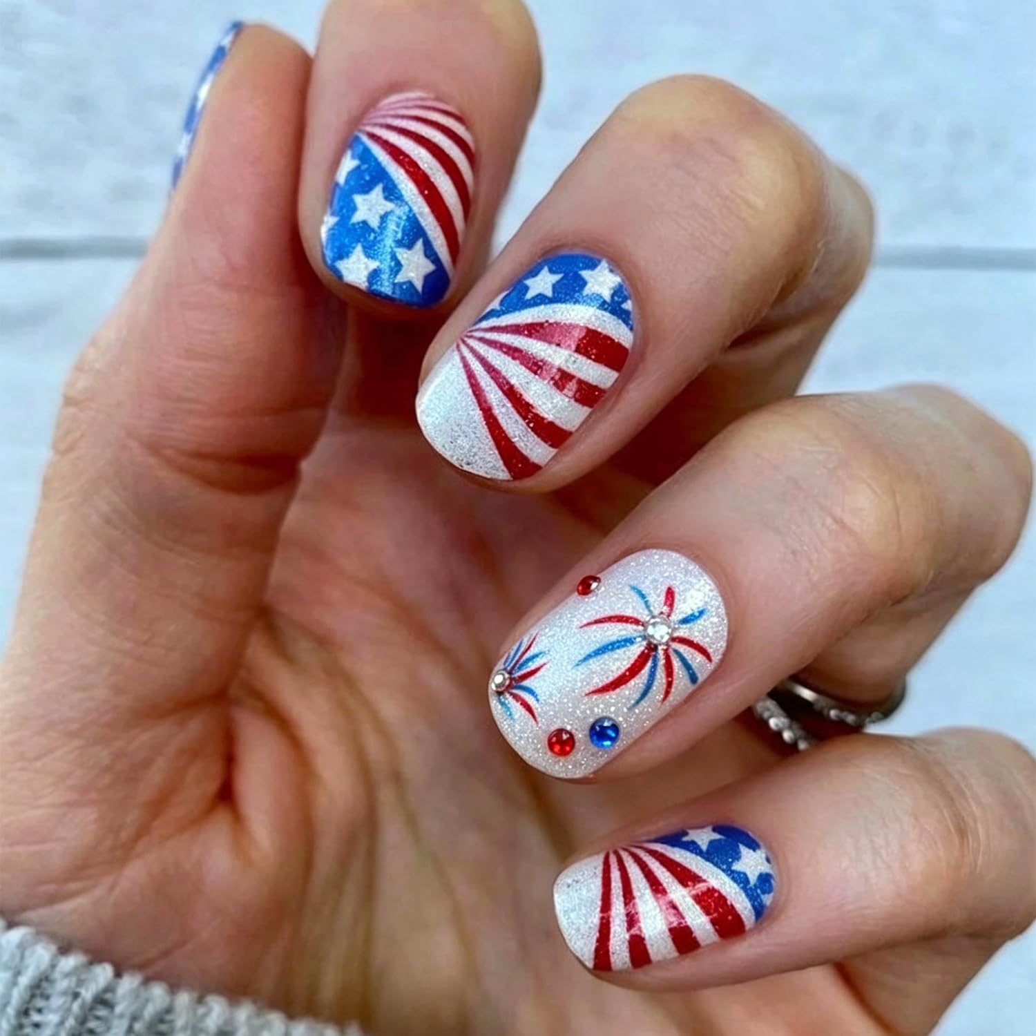NZRAESTRS front packaging showing 24 patriotic press-on nails for quick styling