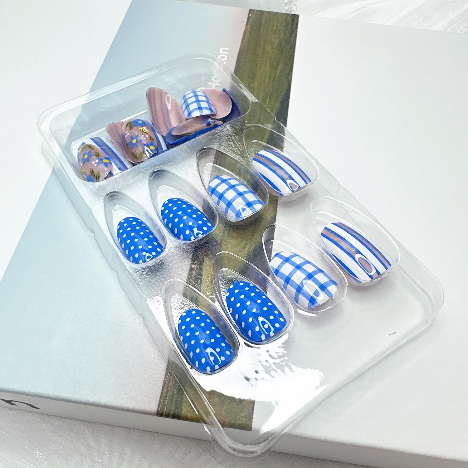 NZRAESTRS short almond nails in hand showing scale and natural-looking fit benefit