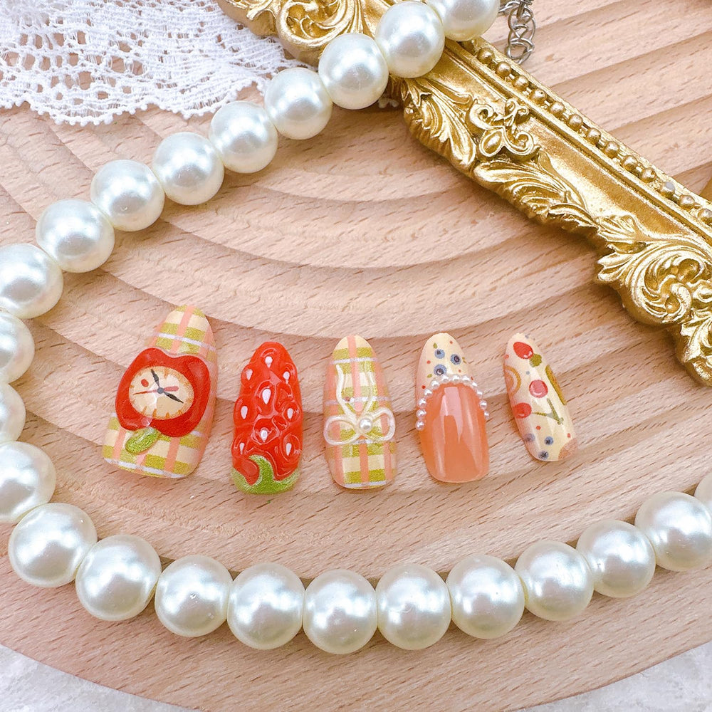 NZRAESTRS lifestyle shot of woman wearing summer fruit nails, playful everyday style