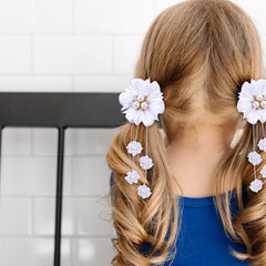 OAOLEER bow clipped in a girl's ponytail demonstrating comfortable hold during wear